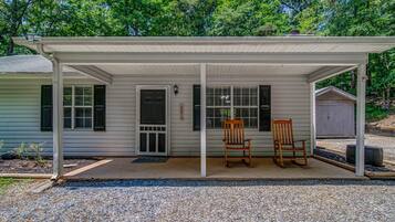 Relax on the covered porch with two comfortable rocking chairs.