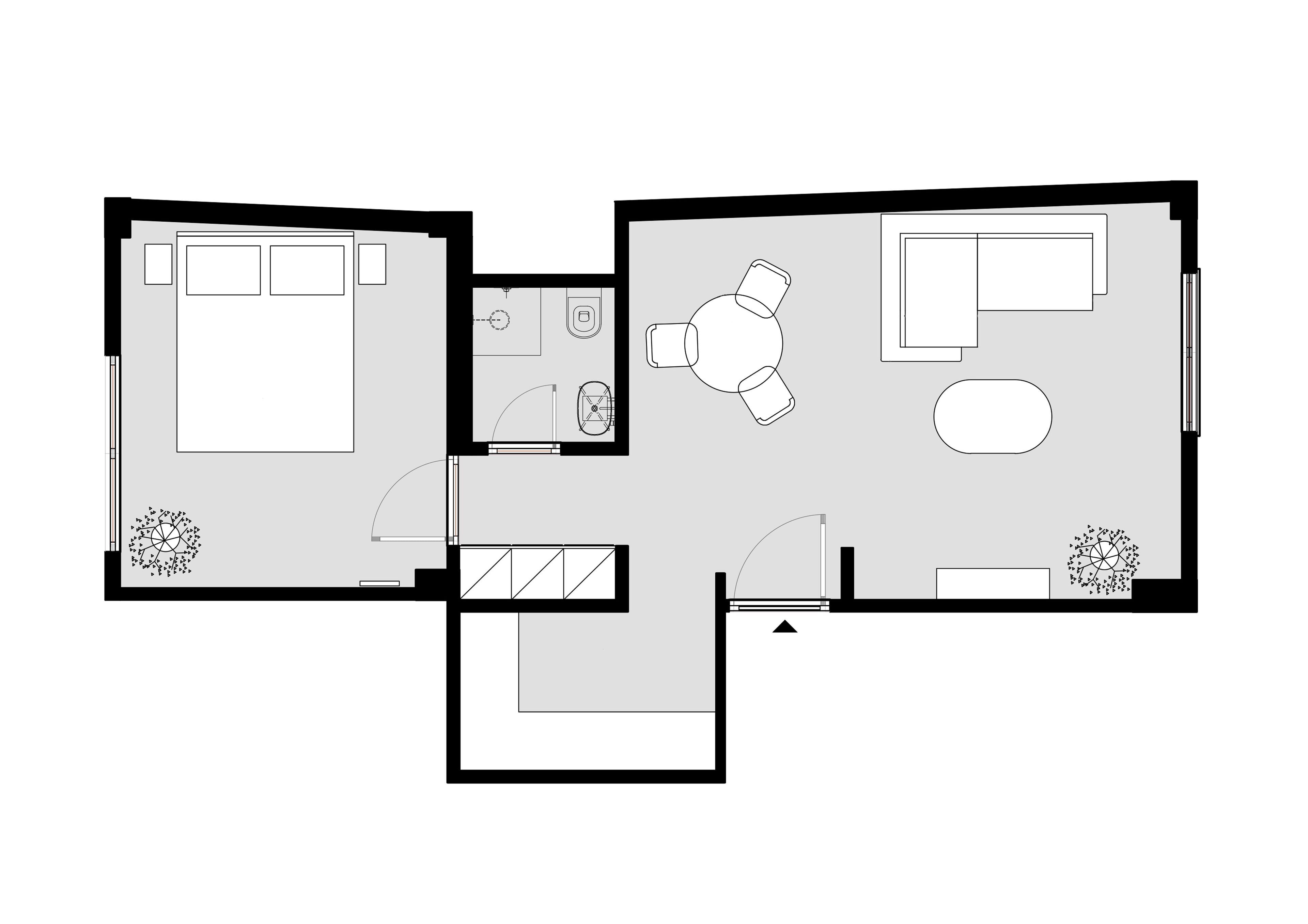 Un plan d’étage d’une chambre d’hôtel comprenant un lit, un bureau, une chaise, une petite table et un canapé.