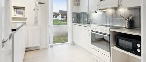 Fridge, oven, cookware/dishes/utensils