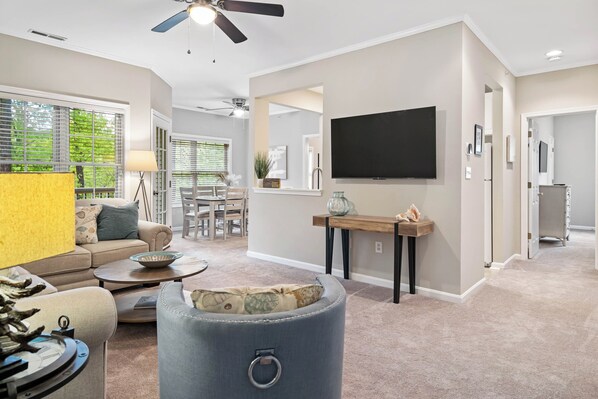 Condo, Multiple Beds, Balcony, Garden View | Living area | TV