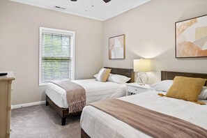 Condo, Multiple Beds, Balcony, Garden View | 2 bedrooms, individually decorated, individually furnished, free WiFi