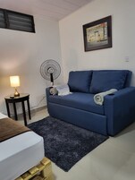 Deluxe Studio, 1 Bedroom, A | Living area | 32-inch Smart TV with cable channels