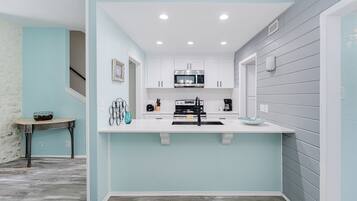 Townhome, Multiple Beds, Balcony | Private kitchen | Fridge, microwave, oven, stovetop