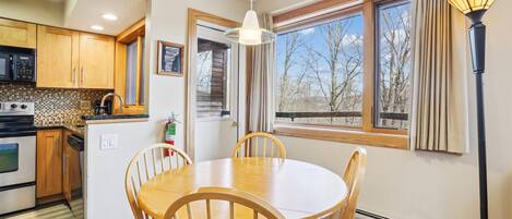 Gather Around the Table - The dining area is the perfect place to enjoy meals, morning coffee, or an evening game together.