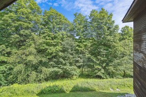 Surrounded by lush greenery, this serene setting offers a peaceful escape.
