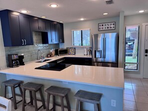 Fridge, microwave, oven, stovetop - Watch dolphins & pelicans from this 2 bedroom/2 bath waterfront condo. (Bradenton Beach)