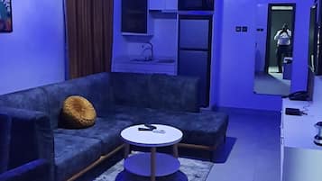 Deluxe Apartment, 1 Bedroom | Living area | 48-inch LED TV with satellite channels, Netflix, streaming services