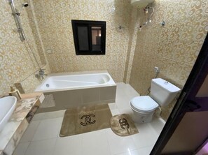 Shower, towels, soap, toilet paper