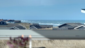 A coastal view with houses and a beach.