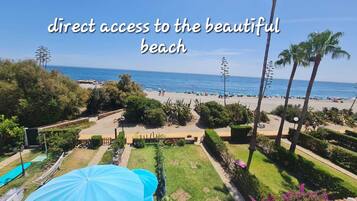 On the beach, sun-loungers, beach towels