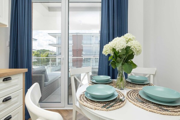Enjoy a romantic dinner for two in this beautifully set dining area with a view of the surrounding landscape.