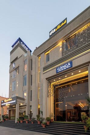 A hotel with a modern facade, featuring the name 'Ganga Bliss' prominently displayed. - The Ganga Bliss by DLS Hotels (Haridwar)