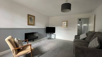 Basic Apartment | Living area | 40-inch LCD TV with cable channels