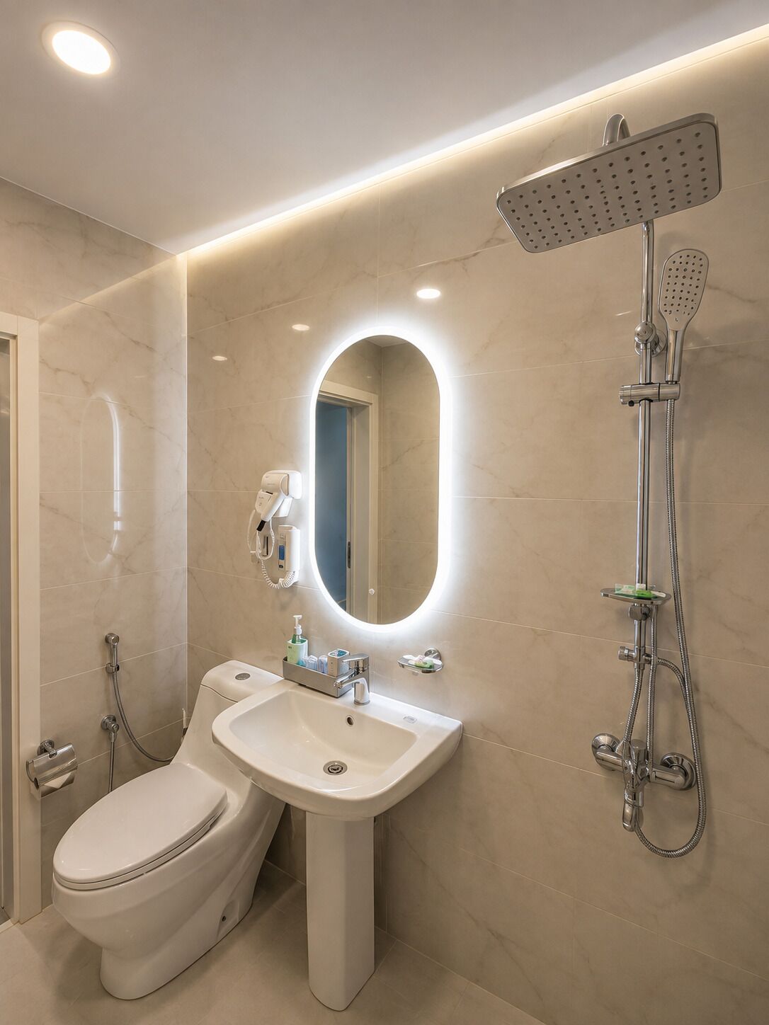 A modern bathroom with a toilet, sink, and shower.