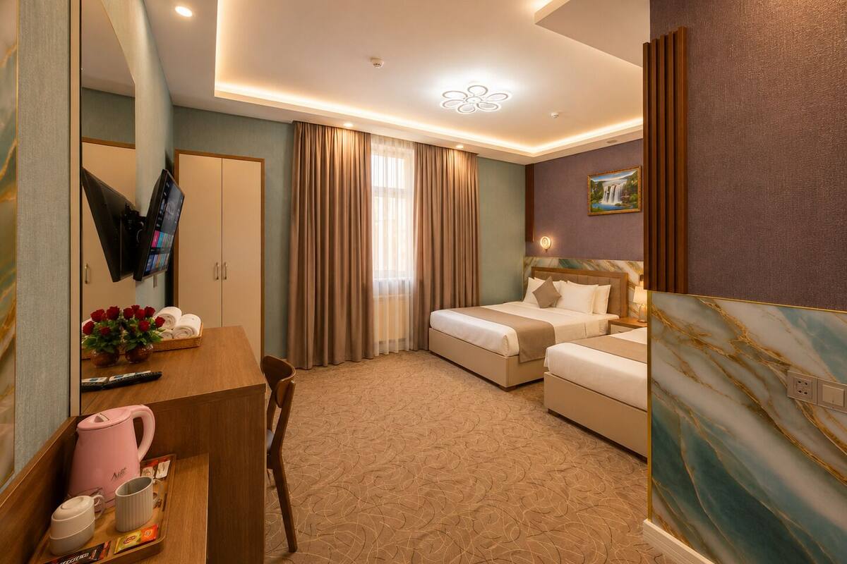 Executive Triple Room | Minibar, in-room safe, desk, laptop workspace