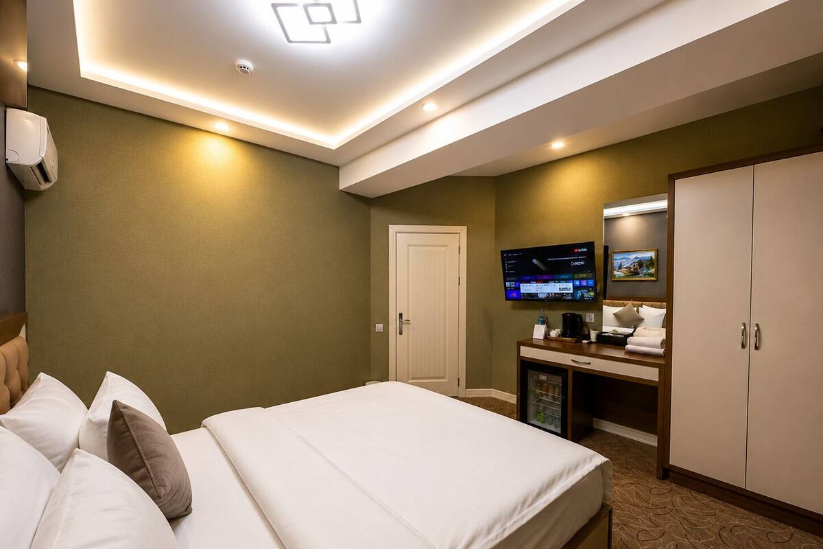 Family Suite, City View | Minibar, in-room safe, desk, laptop workspace