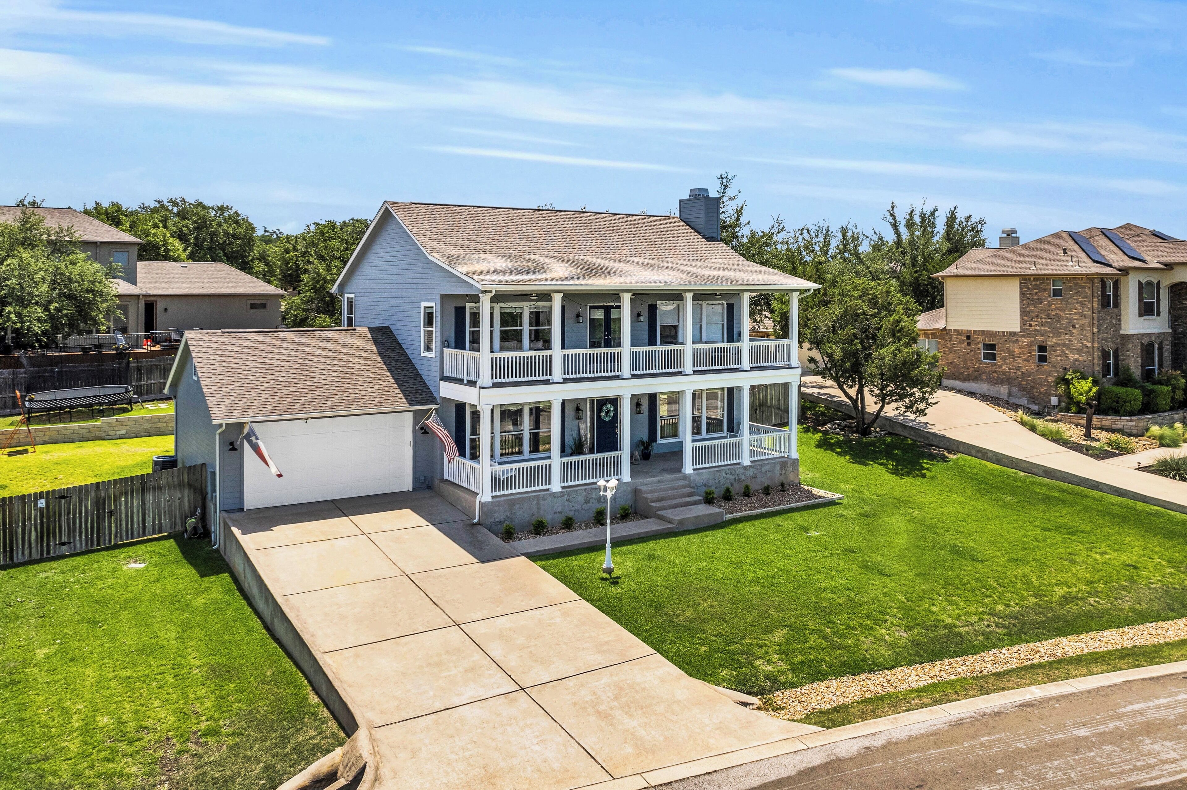 Lake Travis family-sized lakehouse with game room, deck and private beach access