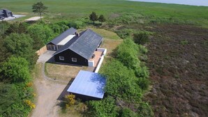 A modern house with a large garage, a solar panel, and a view of the sea. - "Toralf" - 3.5km from the sea by Interhome (Rømø)