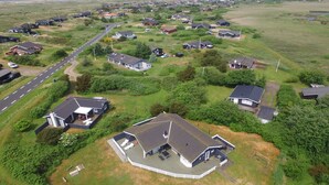 An aerial view of a residential area with houses, a main road, and a large open field. - "Chrisse" - 550m from the sea by Interhome (Rømø)