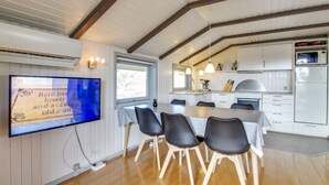 A modern kitchen with white cabinets, a built-in oven, and a microwave. - "Igilfar" - 700m from the sea by Interhome (Vejers Strand)