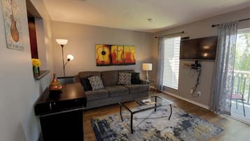 Condo, 1 King Bed, Balcony, Garden View | Living area | TV