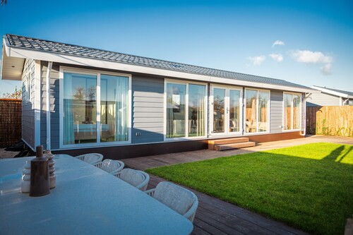 Waterfront luxury tiny home near Amsterdam with spacious private garden