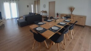 A modern living room with a dining area. - Villa with 4 bedrooms and pool (FRESPECH)