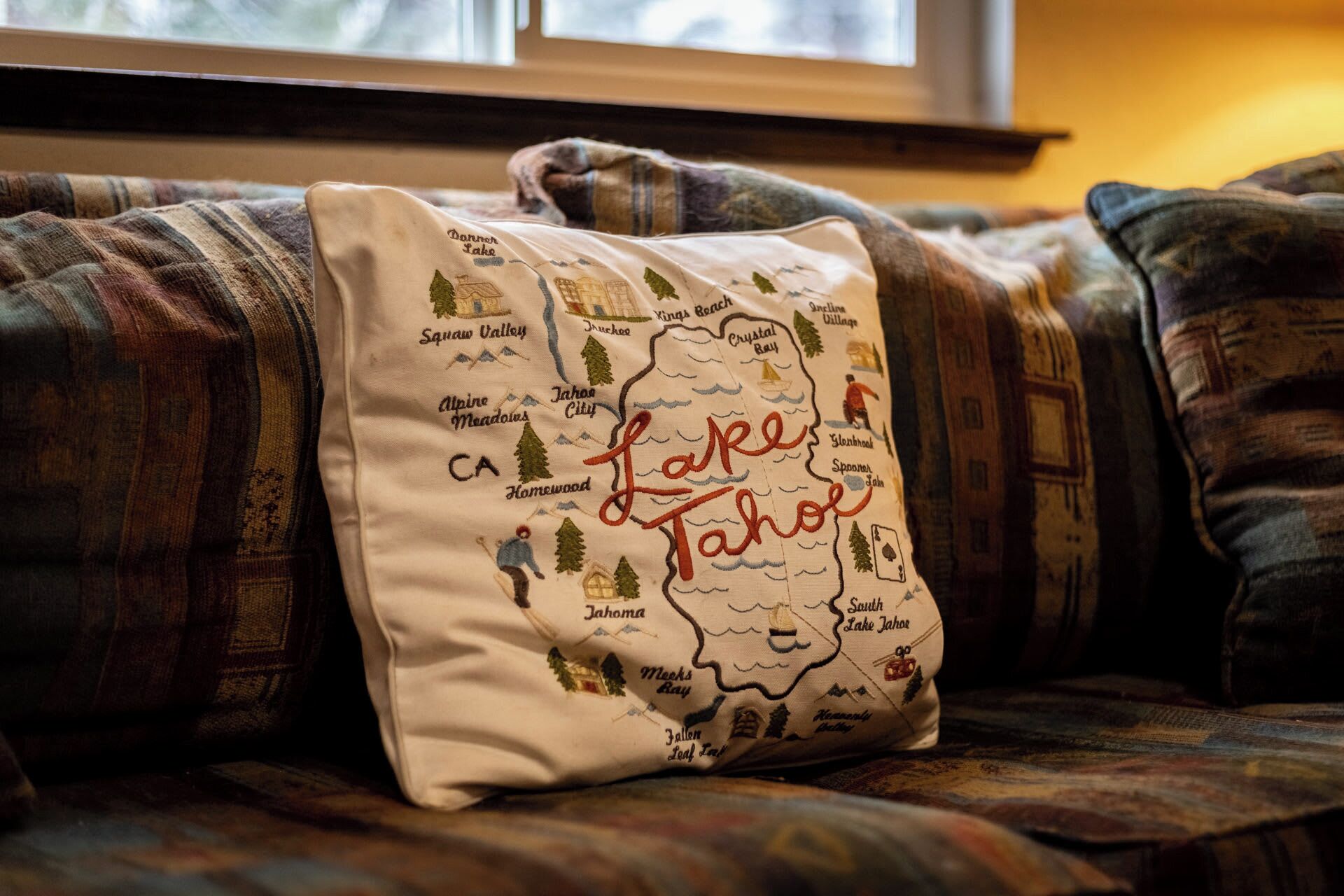 A pillow with a map of Lake Tahoe, including names of towns and landmarks.