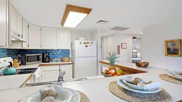 Condo, Multiple Beds, Balcony, Partial Ocean View (Plumeria Hale) | Private kitchen | Coffee/tea maker, fridge, microwave, oven