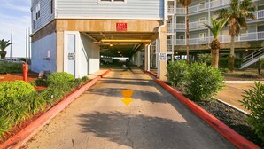 A building with an 'EXIT ONLY' sign above a covered walkway. - Seascape 1108 in Galveston (Galveston)