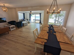 Enjoy meals with family and friends at the large dining table in this stylish living area.
