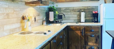 Fridge, microwave, stovetop, coffee/tea maker
