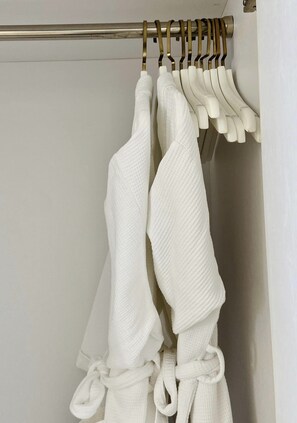 A bathroom with a towel rack holding several white towels. - Zahoo house in Panorama Nha Trang  (Nha Trang)