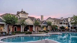A swimming pool area with lounge chairs and a brick walkway. - Amazing Location Near Cary/Morrisville/Apex Downtown, Close to RDU/RTP/ Shopping (Cary)