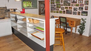 A kitchen with a wooden island, white cabinets, a radio, and a window with a view of greenery. - "Beatha" - 25km to the fjord by Interhome (Sønder Felding)
