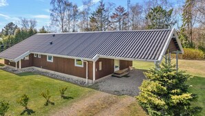 A modern two-story building with a sloped roof, large windows, and a covered outdoor area. - "Wegher" - 650m from the sea by Interhome (Væggerløse)