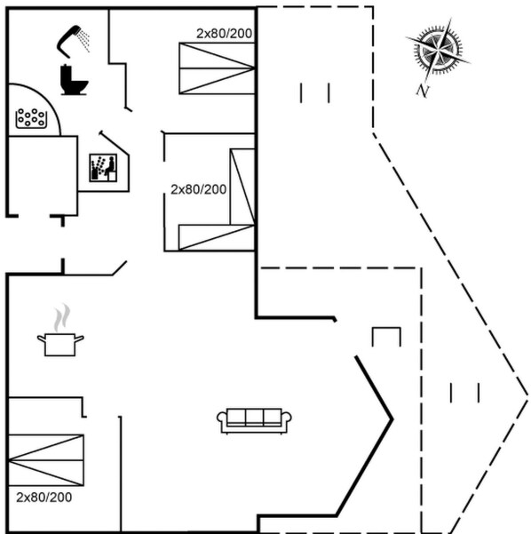 Een plattegrond met een keuken, badkamer en een woonkamer met een bank.