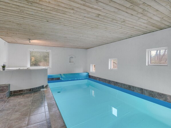 A swimming pool with a wooden ceiling, a built-in bench, and a small window. - "Vicktoria" - 500m to the fjord by Interhome (Blåvand)