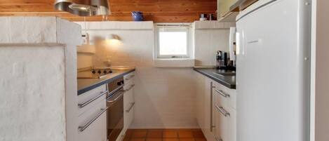 Fridge, dishwasher, high chair, cookware/dishes/utensils
