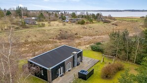 A modern house with a large deck and a view of a lake. - "Tenna" - 250m to the fjord by Interhome (Højslev)