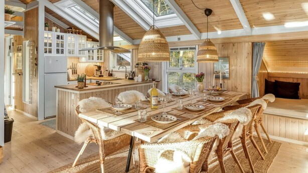 A spacious kitchen with high ceilings, wooden beams, and a large island. - "Berenice" - 250m from the sea by Interhome (Hals)