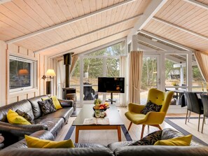 A modern living room with a fireplace, leather sofas, a coffee table, and a TV. - "Abiorn" - 2.5km from the sea by Interhome (Blåvand)