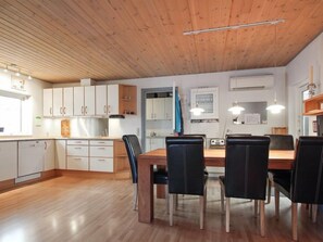 Enjoy meals in this kitchen with a central island and dining area.