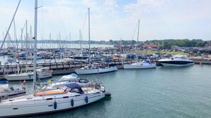 A marina with various boats docked, including sailboats and yachts. - "Toska" - 100m to the fjord by Interhome (Rørvig)