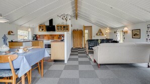 A spacious loft with a high ceiling, a kitchen area, a dining table, and a living area with a sofa. - "Arona" - 1.5km from the sea by Interhome (Fanø)