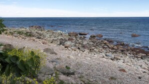 A rocky shoreline with a clear view of the ocean. - "Zina" - 25m from the sea by Interhome (Gudhjem)