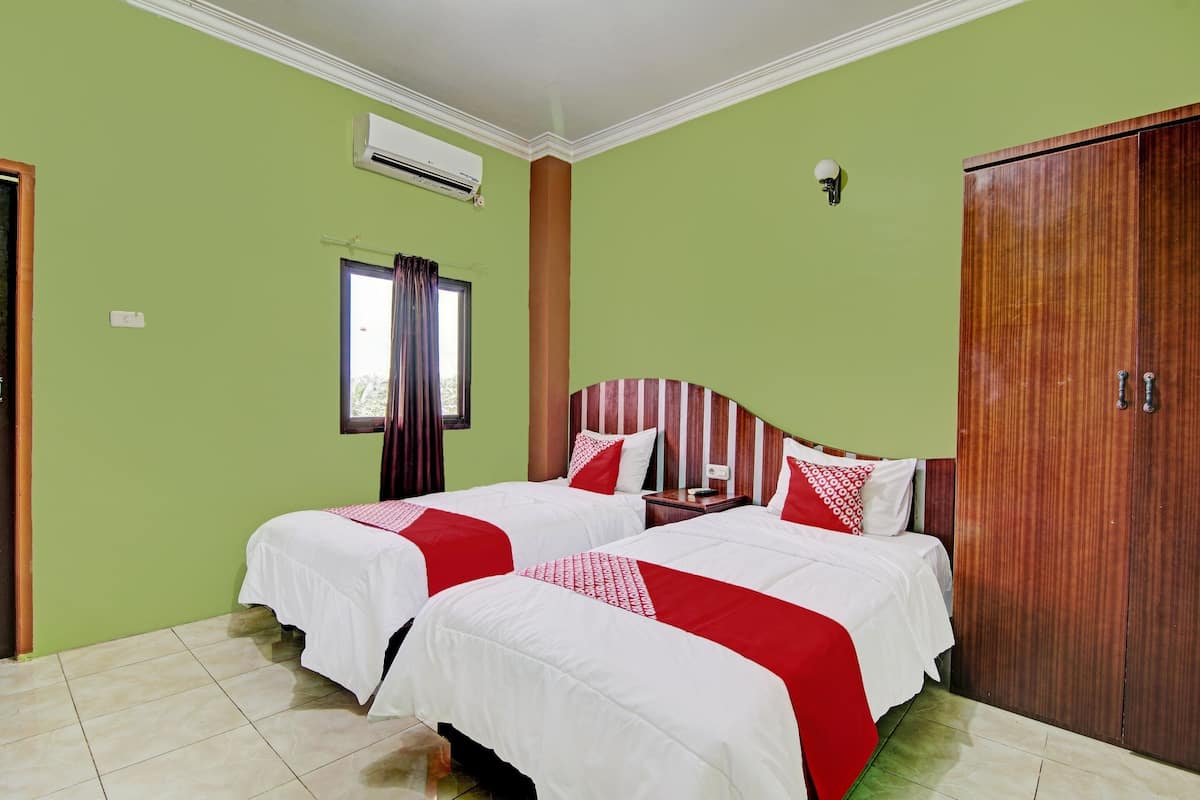 Habitación Deluxe con 2 camas individuales | Wifi gratis y ropa de cama