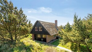 A rustic cabin with a steeply pitched roof, a chimney, and a thatched roof. - "Grita" - 500m from the sea by Interhome (Vejers Strand)