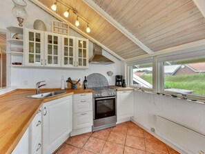 Fridge, oven, high chair, cookware/dishes/utensils
