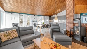 A modern living room with grey sofas, a wooden coffee table, and a fruit bowl. - "Askatla" - 800m from the sea by Interhome (Ringkøbing)